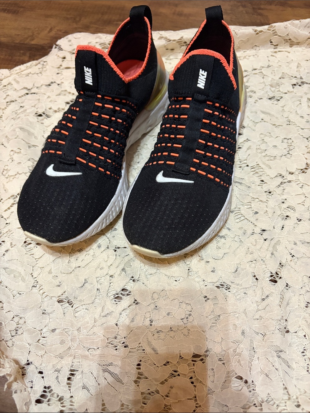 Nike Black and Orange Slip-On Knit Sneakers